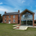 A brick house with a modern extension